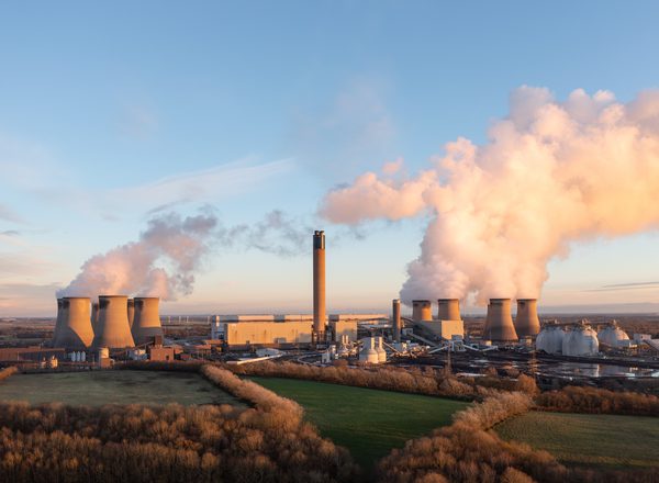 Drax coal fired power plant in North Yorkshire, UK with coal stack and Biomass storage tanks at sunset