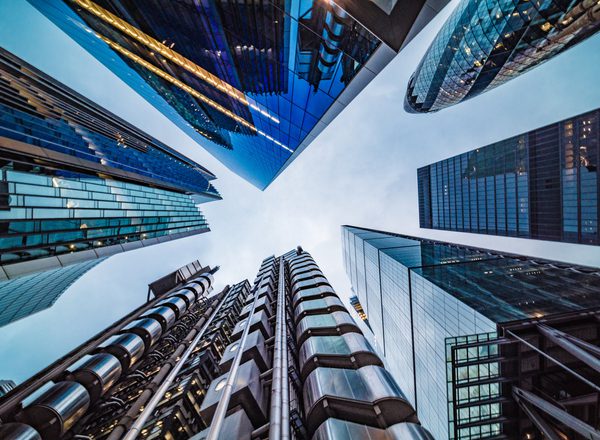 Wide angle view directly up in the skyline of the financial district in central London