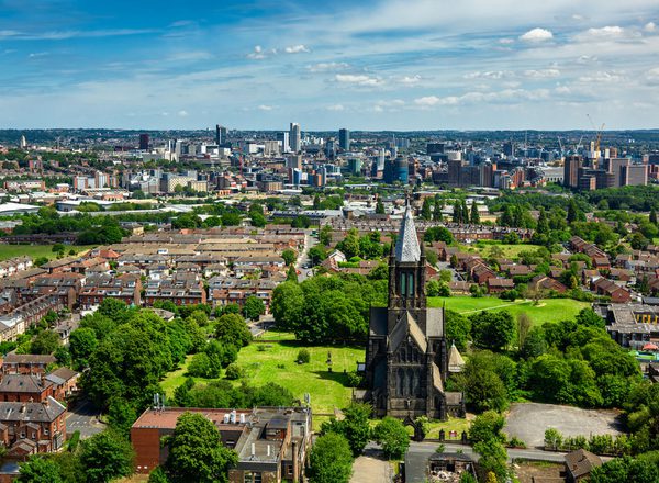 An aerial view of Leeds: the city centre surrounded by green landscape