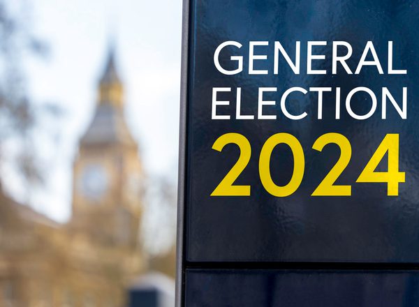 A sign reads, 'general election 2024', with the Elizabeth Tower visible in the background